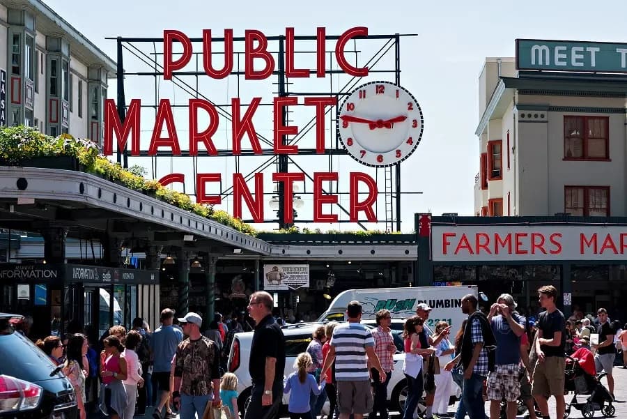 The iconic Pike Place Market sign and bustling marketplace